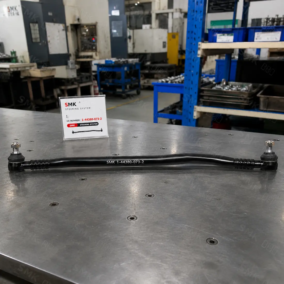 SMK heavy-duty truck drag link assembly on factory inspection table