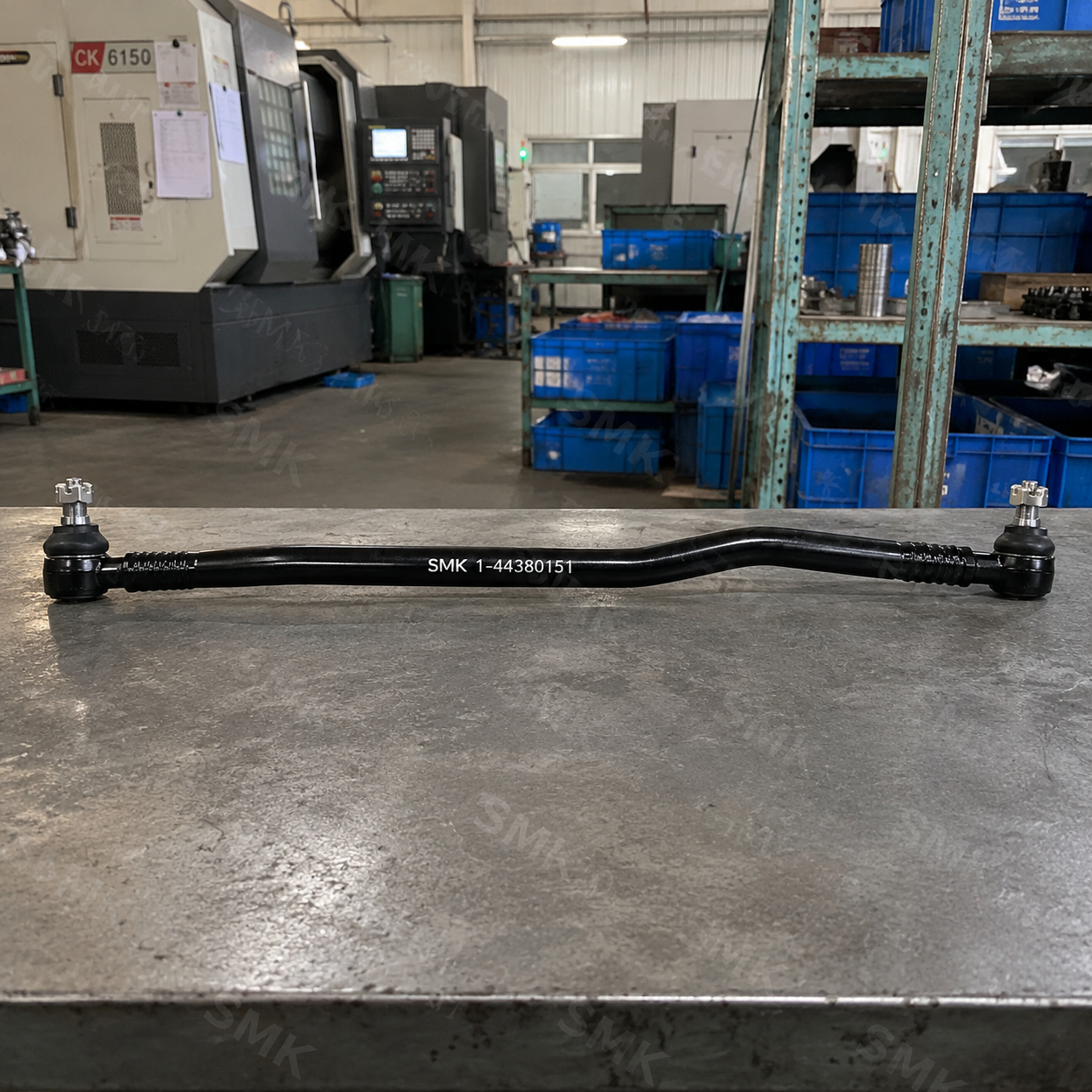 SMK heavy-duty truck drag link assembly on factory inspection table