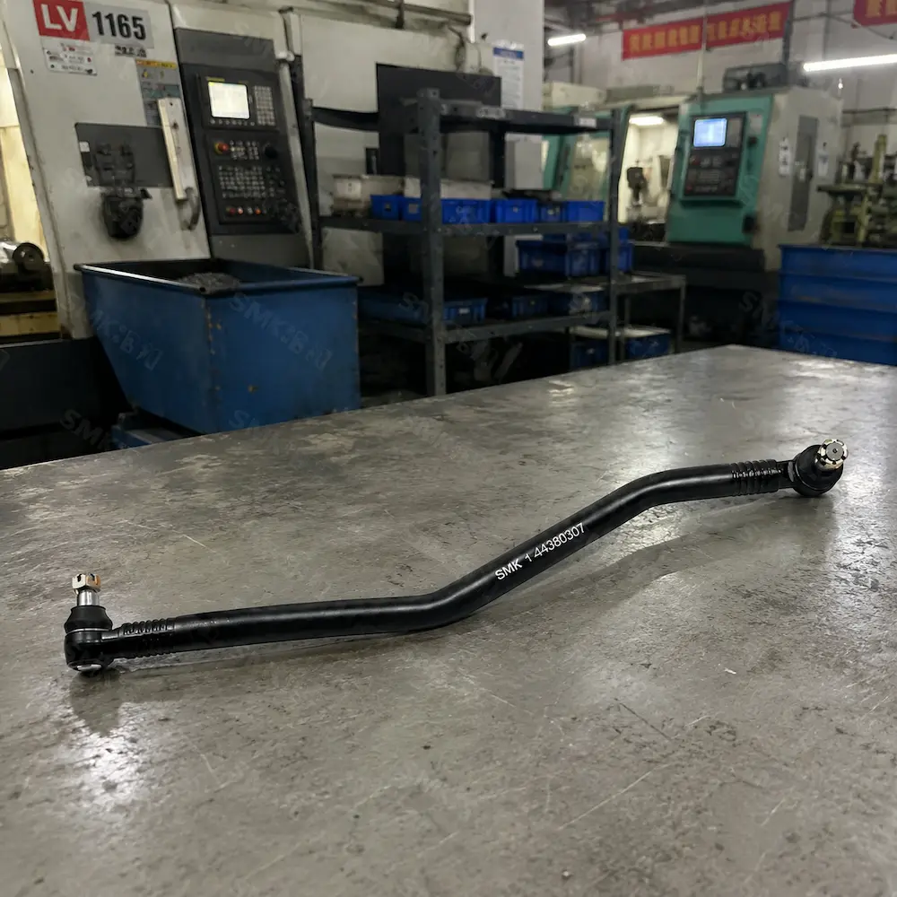 SMK bent heavy-duty truck drag link assembly on factory workbench
